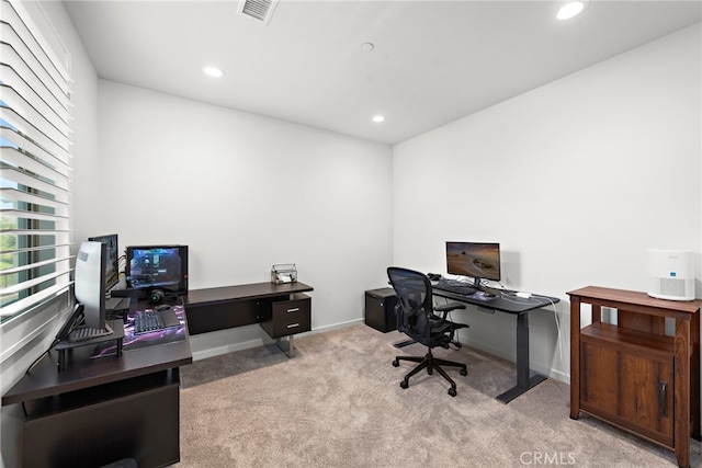 carpeted office space featuring recessed lighting, visible vents, and baseboards