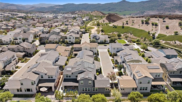 birds eye view of property with a mountain view and a residential view