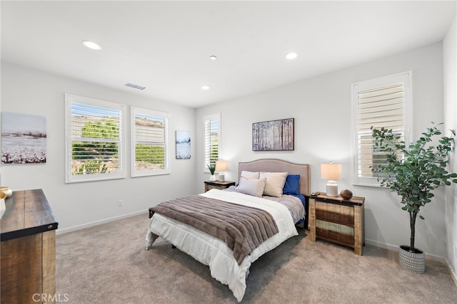 bedroom featuring recessed lighting, carpet, visible vents, and baseboards