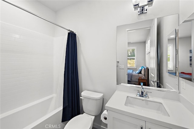 full bath featuring toilet, vanity, shower / tub combo with curtain, and ensuite bathroom