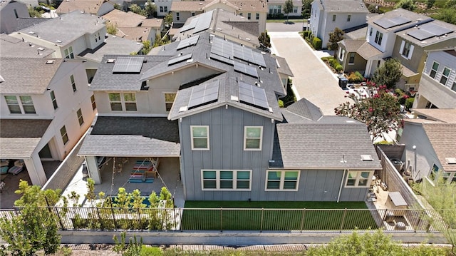 birds eye view of property with a residential view