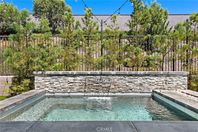 view of pool with fence