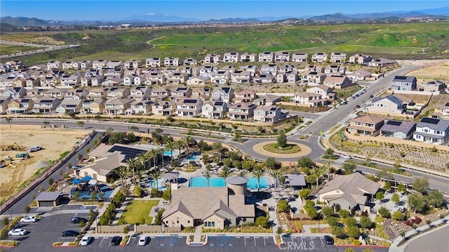 drone / aerial view featuring a mountain view and a residential view