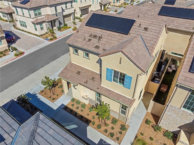 birds eye view of property with a residential view