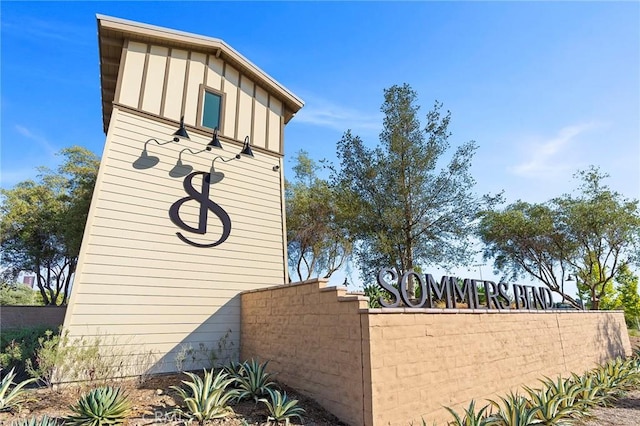 community sign featuring fence