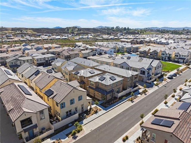 drone / aerial view with a residential view and a mountain view