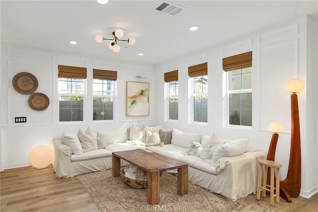 sunroom / solarium featuring visible vents and plenty of natural light