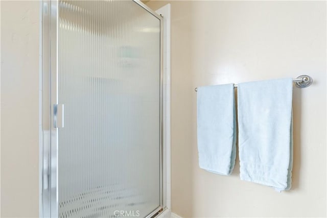 full bath featuring a stall shower