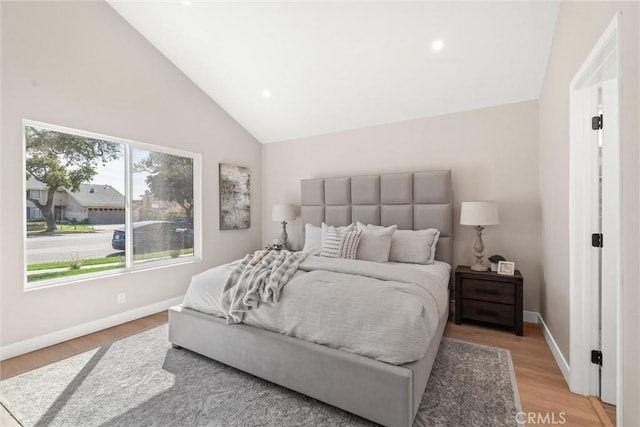 bedroom featuring high vaulted ceiling, recessed lighting, light wood-style flooring, and baseboards