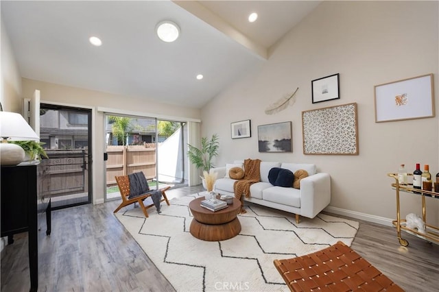 living room with high vaulted ceiling, beamed ceiling, wood finished floors, and baseboards