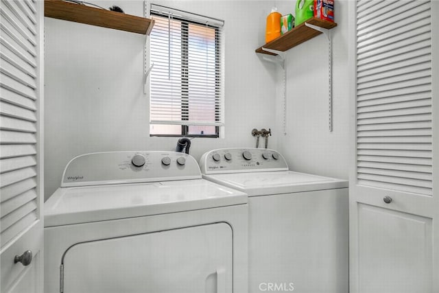 clothes washing area with laundry area and washing machine and clothes dryer