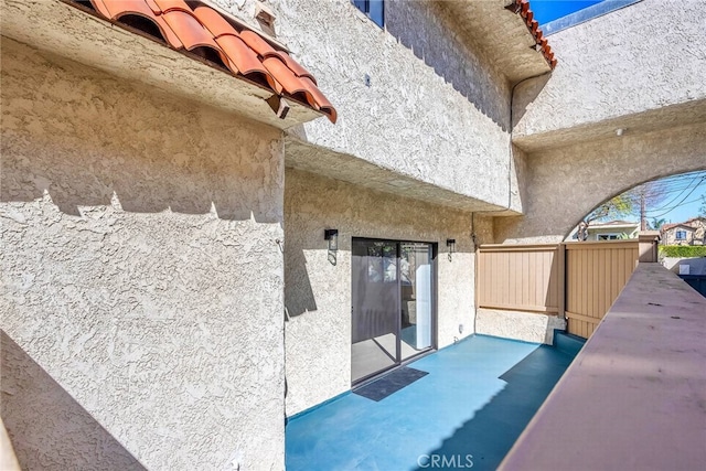 entrance to property featuring stucco siding