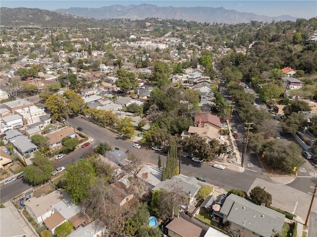 drone / aerial view featuring a residential view and a mountain view