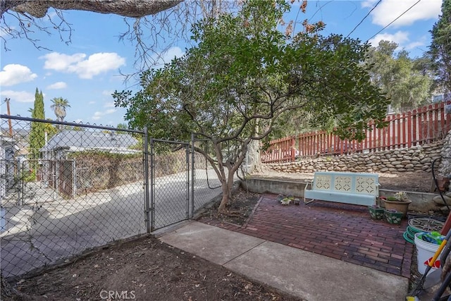 view of gate with fence