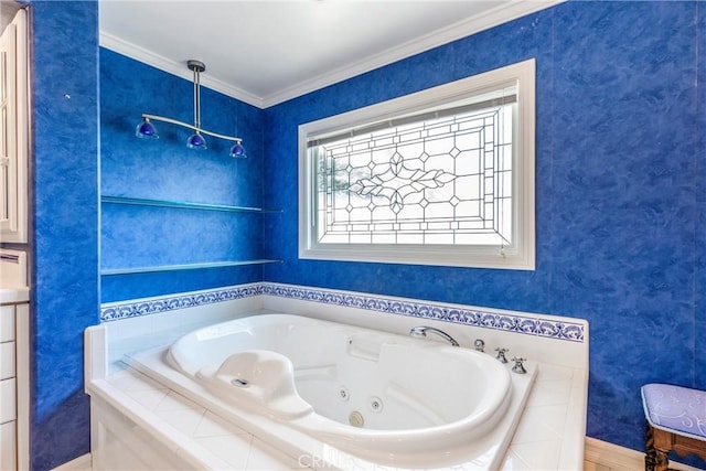 bathroom featuring ornamental molding and a tub with jets