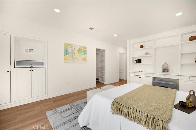 bedroom featuring recessed lighting, light wood-style flooring, and baseboards