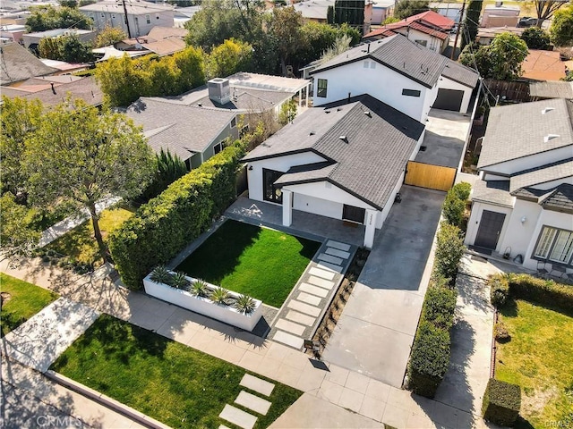 birds eye view of property with a residential view