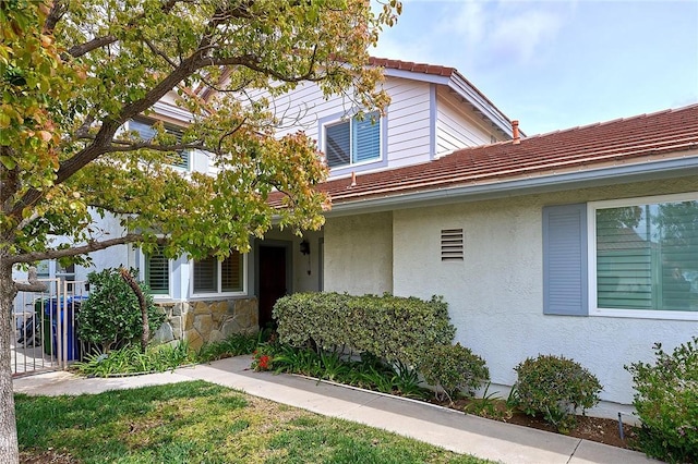 view of front of property with stone siding and stucco siding