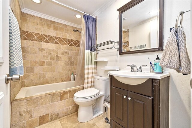 bathroom with ornamental molding, tiled shower / bath combo, vanity, and toilet