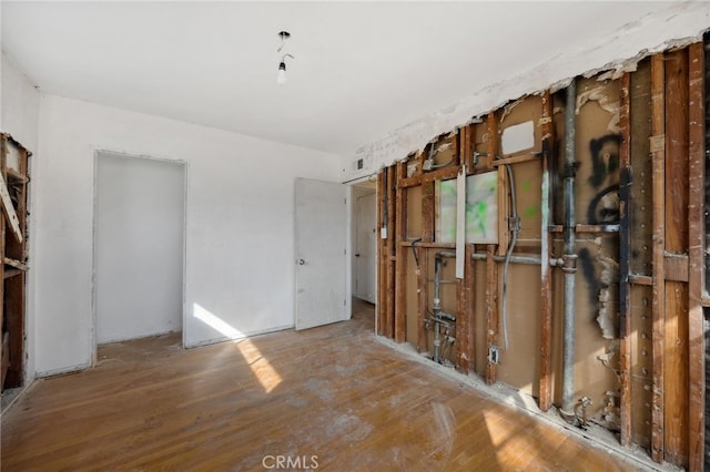 unfurnished room featuring wood finished floors