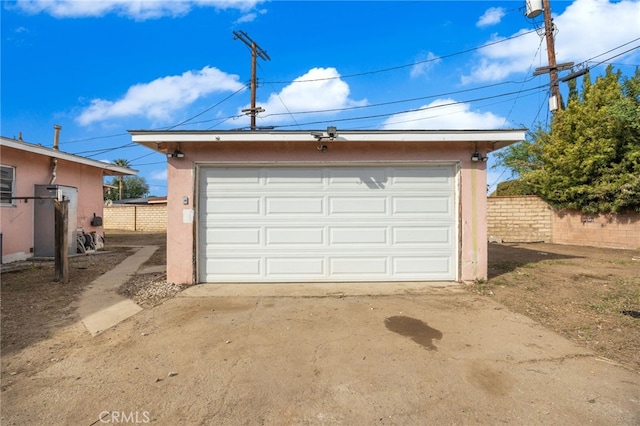 detached garage with fence