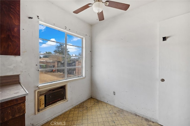 unfurnished room with ceiling fan and light floors