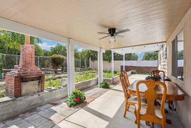 sunroom with wood ceiling, ceiling fan, and a wealth of natural light