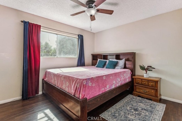 bedroom featuring a textured ceiling, wood finished floors, a ceiling fan, and baseboards