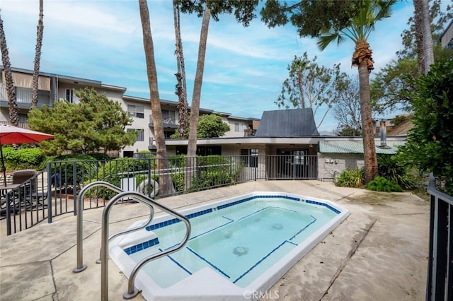 view of pool with a community hot tub