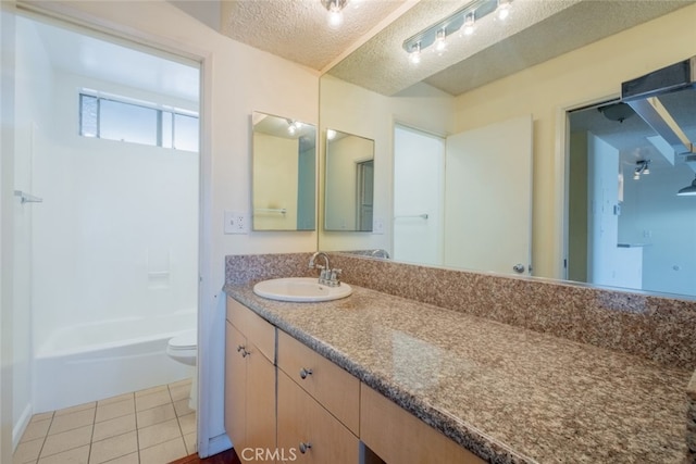 bathroom featuring vanity, tub / shower combination, a textured ceiling, tile patterned floors, and toilet