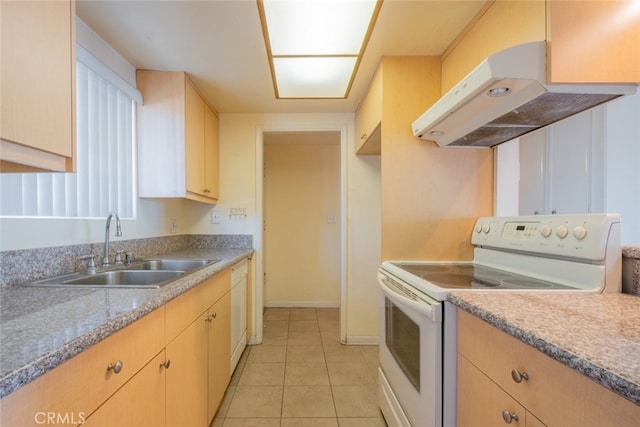 kitchen with white appliances, light tile patterned floors, a sink, light countertops, and under cabinet range hood