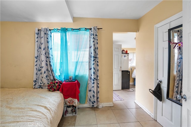 tiled bedroom with baseboards