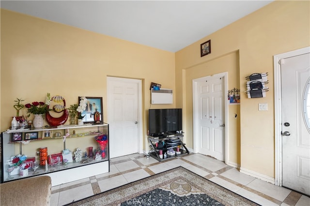 foyer entrance with baseboards