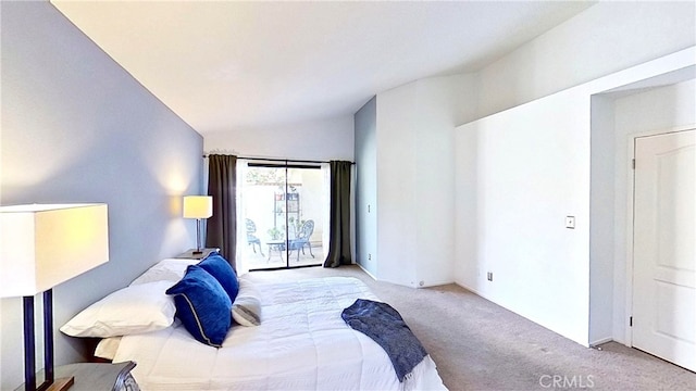 bedroom featuring lofted ceiling, carpet, and access to exterior