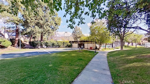 view of front of property with a front lawn and fence