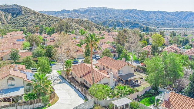 aerial view with a mountain view and a residential view