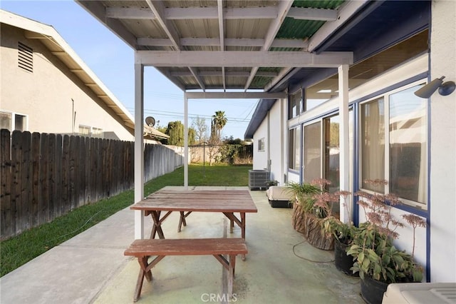 view of patio / terrace featuring fence and central AC unit