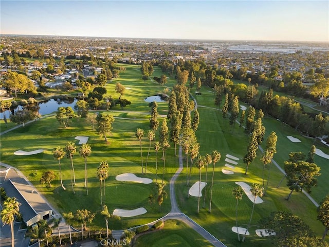 drone / aerial view featuring a water view and golf course view