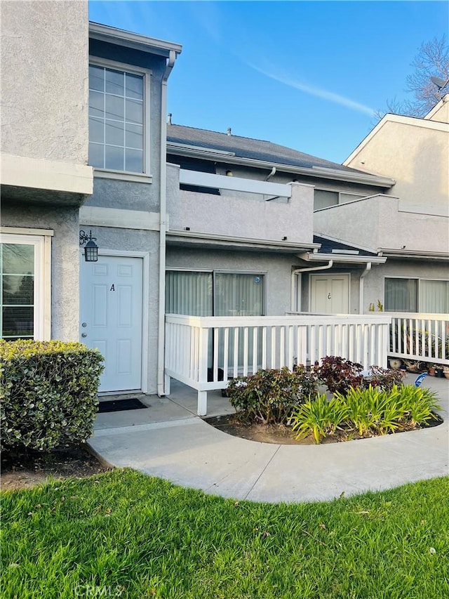 exterior space featuring stucco siding