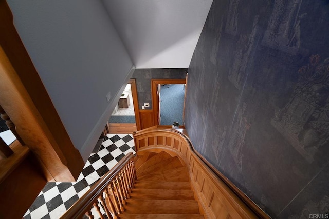 staircase featuring vaulted ceiling