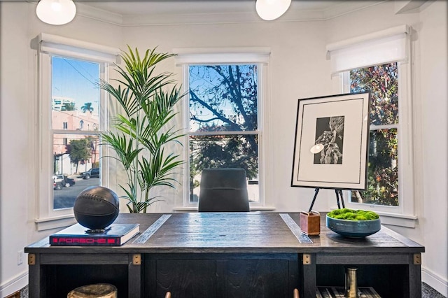 office area featuring crown molding and baseboards