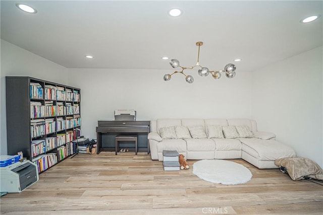 living room with recessed lighting and wood finished floors