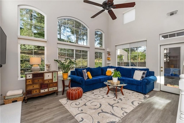 sunroom / solarium featuring ceiling fan and visible vents