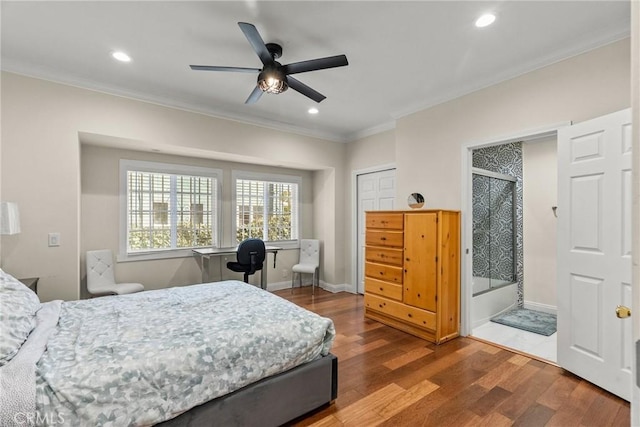 bedroom with recessed lighting, crown molding, baseboards, and wood finished floors