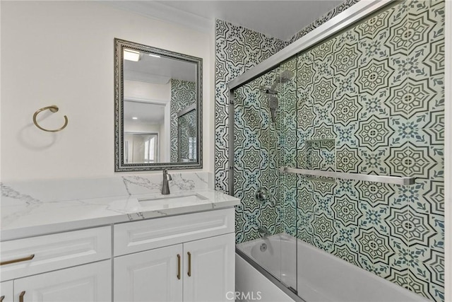 bathroom featuring vanity and enclosed tub / shower combo