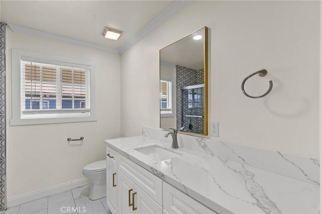 bathroom featuring toilet, a stall shower, ornamental molding, baseboards, and vanity