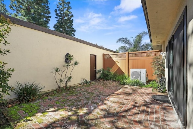 view of yard featuring ac unit, a patio area, and fence