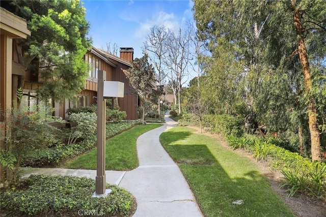 view of home's community featuring a lawn