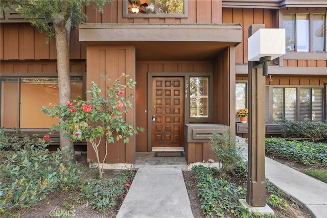 doorway to property featuring board and batten siding