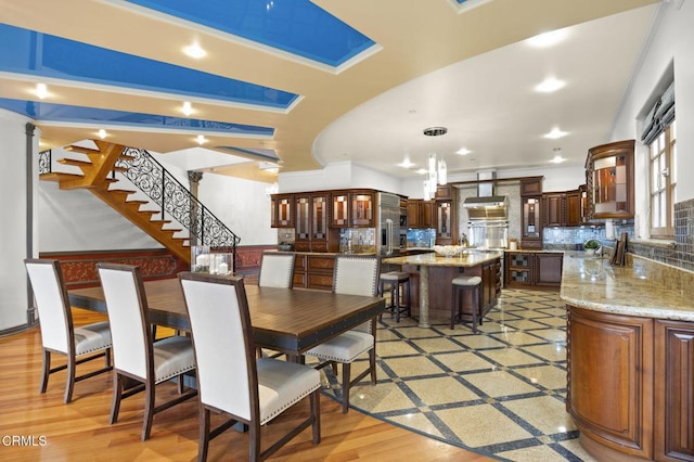 dining space with stairs and recessed lighting